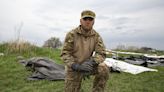 On Ukraine’s battlefields, this group respects fallen soldiers – no matter which side