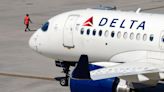 Delta Air Lines says cancellations continue as it tries to restore operations after tech outage