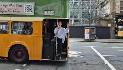 Moment Scots rockers Travis perform for fans from back of a Glasgow bus