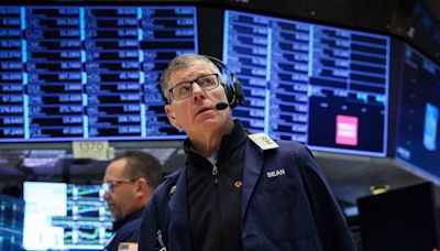 Nasdaq, S&P tumble as Netflix, chip stocks drag; AmEx boosts Dow