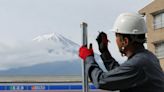 Japanese town blocks iconic Mount Fuji view to stop bad behaviour by tourists