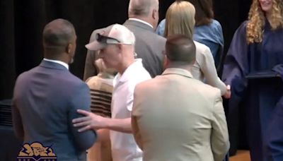 Video of man pushing Black superintendent at daughter's graduation sparks racism claims