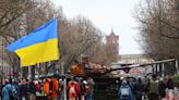 Vigils and a wrecked tank as Ukraine's allies mark year of war