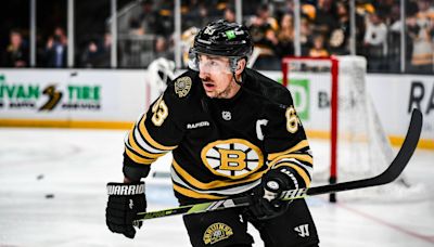 Latest updates on Bruins captain Brad Marchand's upper body injury