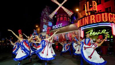 Moulin Rouge's iconic windmill sails restored after collapse just in time for the Olympics