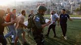 Israel hits Hezbollah targets in Lebanon after deadly football pitch attack