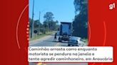 VÍDEO: Caminhão arrasta carro enquanto motorista se pendura na janela e tenta agredir caminhoneiro em Araucária