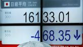 Asian stocks mixed before more rate cues, Japan dips on strong wage data