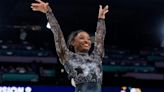 Simone Biles shakes off calf injury to dominate during Olympic gymnastics qualifying