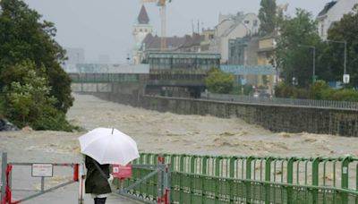 Vienna streets and houses flooded as river overflows banks