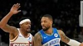 Milwaukee's Damian Lillard, at right driving against Phoenix's Bradley Beal, scored 31 points and added 16 assists in a 140-129 NBA victory over the visiting Suns