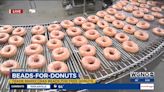 Trade your Mardi Gras beads for free doughnuts at Krispy Kreme