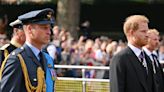 Why Prince Harry wore a suit — instead of military attire — as he walked next to Prince William behind the Queen's coffin