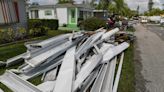 Families pick up pieces after strong winds tear through Port St. Lucie area community