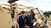 Rishi Sunak gets behind the wheel of an armoured car in visit to South West