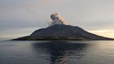 Airport near volcano reopens as Indonesia lowers eruption alert level