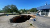 Owner forced to sell shop threatened by massive sinkhole in Mooresville