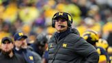 Michigan's Jim Harbaugh deserves lifetime contract, Larry Foote says: 'Give him a blank check'