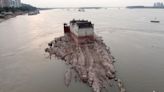 PHOTOS: Drought consumes China's most vital waterway, revealing historic structures and riverbeds