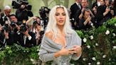 Kim Kardashian Explains Why She's Awkwardly Holding a Sweater at Met Gala