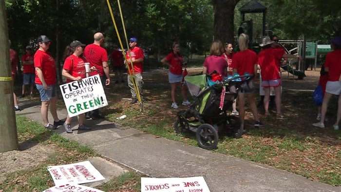 Parents, children demonstrate what walk to new school would look like if Fishweir Elementary closes