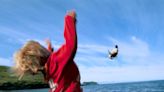 Locals throw baby puffins off clifftops on a remote island in Iceland to help the stray birds take flight
