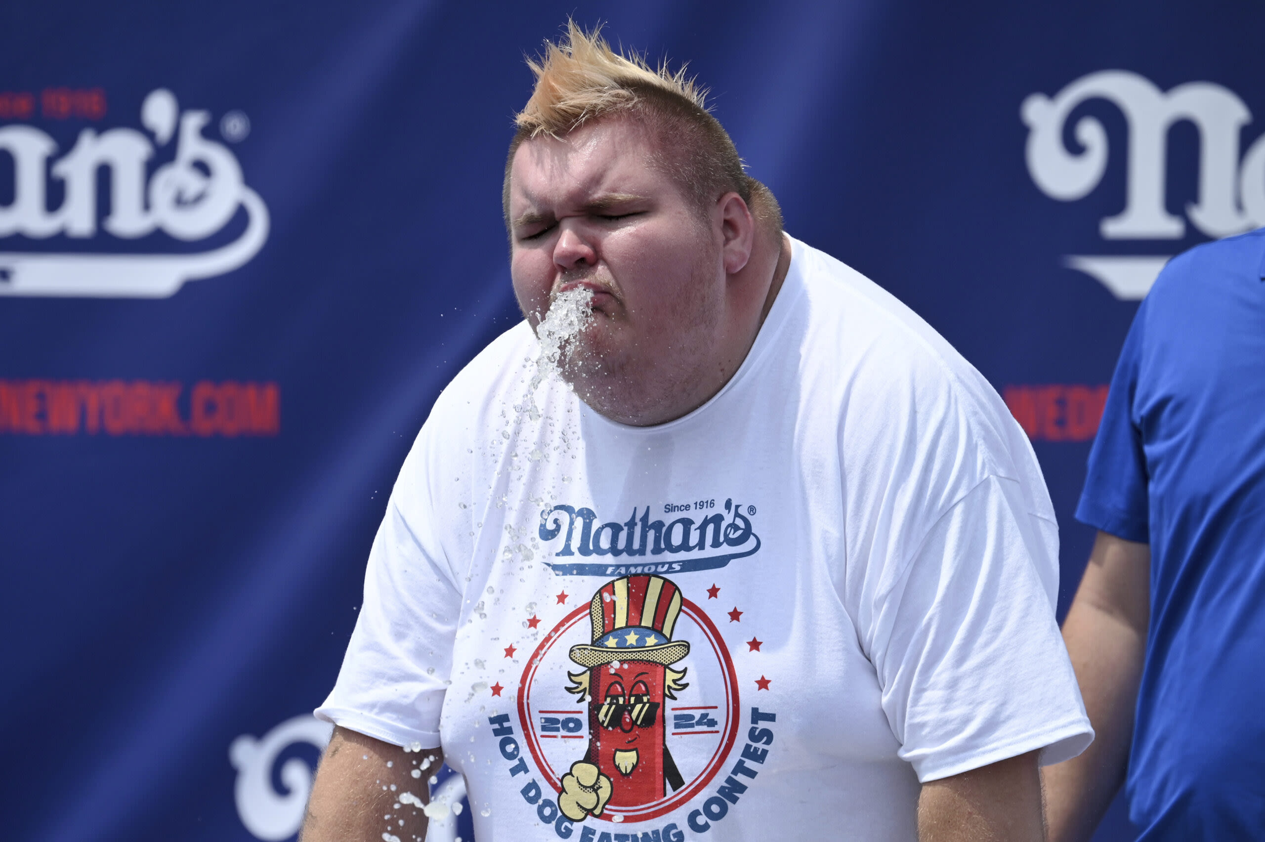 Nathan’s Lemonade Drinking Contest Goes Horribly Wrong as Competitor Hurls During Celebration