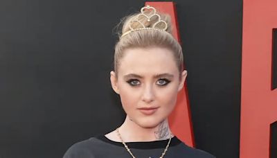 Kathryn Newton channels edgy punk rock look with fake tattoos as she joins a glamorous Melissa Barrera at the LA premiere of horror flick Abigail