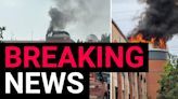 Shopping centre catches fire as huge plumes of smoke rise into the sky