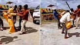 Woman beaten mercilessly with a wooden stick by 4 men; onlookers shoot video