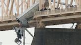 Rescue of truck driver dangling from bridge was a team effort, firefighter says