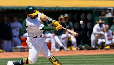 Athletics muscle up in first game of doubleheader to beat Rangers
