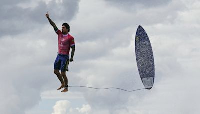Brazilian surfer appears to walk on water, and other photos from Monday and Tuesday at the 2024 Paris Olympics