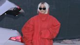 Kim Kardashian covers up in a HUGE red padded coat