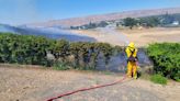 Fire Crews put out grass fire in Clarkston Heights