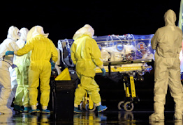 In this photo provided by the Spanish Defense Ministry, aid workers and doctors transfer Manuel Garcia Viejo, a Spanish priest who was diagnosed with the Ebola virus while working in Sierra Leone, from a military plane to an ambulance as he leaves the Torrejon de Ardoz military airbase, near Madrid, Spain, Monday, Sept. 22, 2014. The Spanish priest who was diagnosed with the Ebola virus while working in Sierra Leone has been flown back to Spain and taken to a Madrid hospital. Garcia Viejo, a medical director of the San Juan de Dios Hospital in the city of Lunsar in Sierra Leone, arrived on a medically equipped military plane shortly after 3 a.m. Monday. (AP Photo/Spanish Defense Ministry)