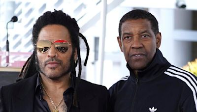 Lenny Kravitz answers video call from 'big brother' Denzel Washington onstage in Italy