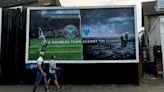 Billboards calling on Wimbledon to drop Barclays as sponsor appear near All England Lawn Tennis Club