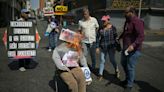 Venezuelans set fire to dummies of Maduro, opposition in Easter rite