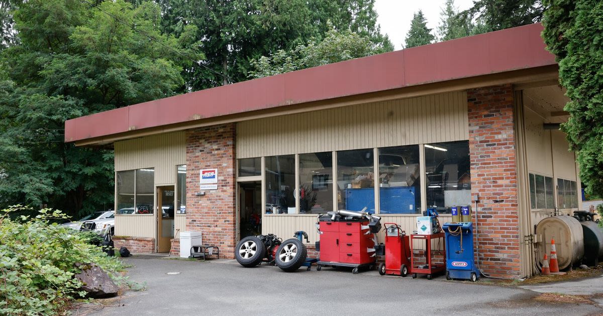 The state is tearing out a salmon-blocking culvert. This auto shop is in the way.