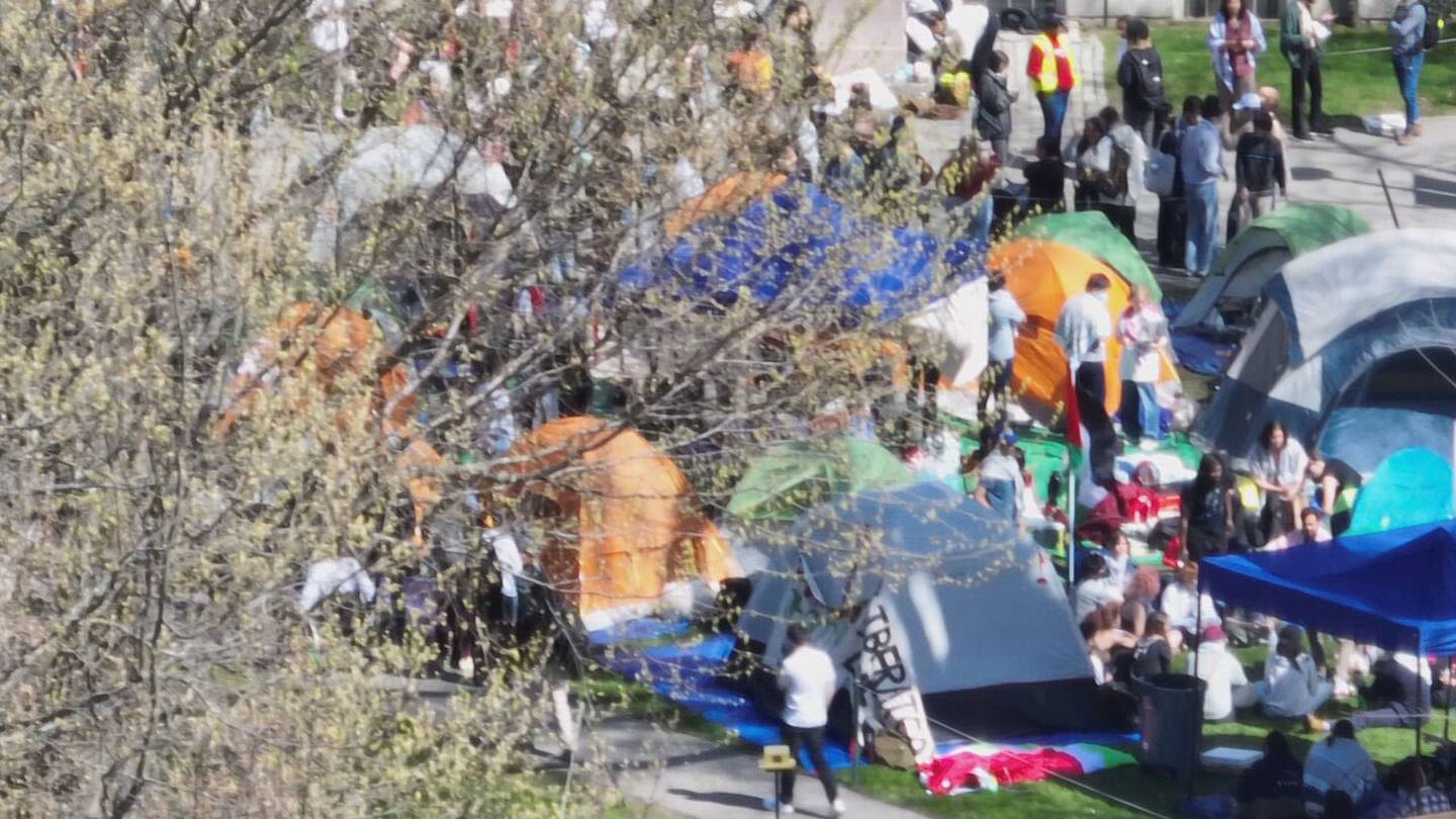 Protesters march to the Harvard University President’s home to make demands following ultimatum