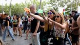 Furious anti-tourist protesters blast foreigners with WATER PISTOLS