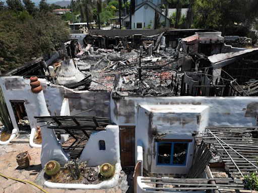 Photos show charred remnants of Riverside neighborhood after firework sparks massive wildfire in California