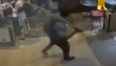 Shocking moment stranger smashes bargoer with piece of wood in unprovoked attack