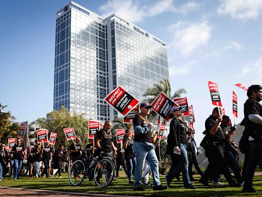 Hundreds of hotel, service workers rally in downtown San Diego for $25-an-hour minimum wage