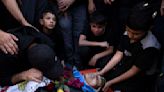 Israeli strikes on southern Gaza city of Rafah kill 22, mostly children, as US advances aid package