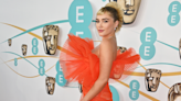 Florence Pugh makes bold BAFTA move with spiky new hair and orange fishtail dress