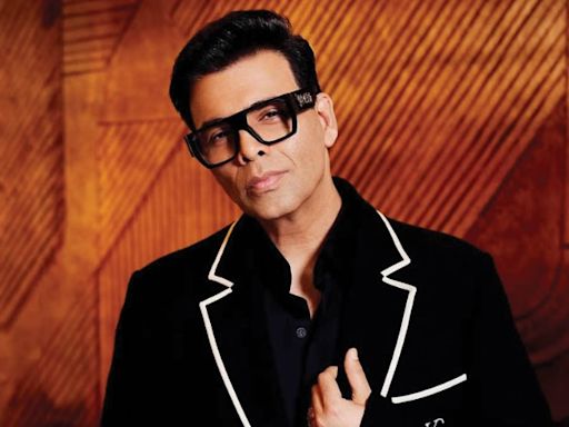 Video: Karan left 'shocked' as IIFA honours his 25-year journey in industry; Touches SRK's feet after receiving the award