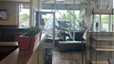 No injuries after car crashes through front of Big Biscuit in Overland Park