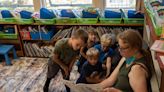Teacher’ s aide Cheryl Furman reads to Jace Johnson, Evie Hippen, Ryden Sizemore and Edward Rich, from left, in the transitional kindergarten-to-second-grade class at...